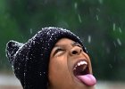 snowkid.JPG  Corey Smith, 10, sticks out his tongue to get a taste of the snow, falling at his home in Union, SC Wednesday evening.  (AP Photo/Spartanburg Herald-Journal/Tim Kimzey)