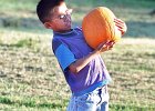 pumpkinbalance.jpg  Tommy Phanly, 7, of Boiling Springs, balances the weight of a pumpkin he has just picked out at the pumpkin patch on Garner Rd. and Pine St. in Spartanburg Wednesday evening. The patch has already sold over 3,000 pumpkins for the Halloween season.