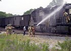 trainfire2.JPG  Spartanburg Public Safety officers and firefighters put out a fire in the engine of a Norfolk-Southern train stopped on the tracks at Beaumont Ave. in Spartanburg Wednesday evening.