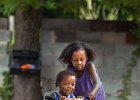 tricyclepush--FIN  Ashante Whiting, 8, stops riding her bicycle to push her little brother George Thomas, 2, on his tricycle at the family&#39;s home in Monarch. Despite the rainy weather, the brother and sister enjoyed the playtime together in Union County, SC Sunday morning, 6-13-04. (AP Photo/Spartanburg Herald-Journal/Tim Kimzey).