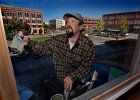windowpainttown--FIN  Tony Brockman, with K.C. Painting of Spartanburg, paints the window trim around a second-story window for the A-Deva Day Spa in downtown Spartanburg Monday morning, 11-15-05.  (NOTE: Stand-alone Feature)