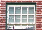 UnionVetwatch.jpg  A woman watches from her window during the Union Veteran&#39;s Day Parade.
