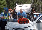 wreck-vanderbilt--FIN  Spartanburg Public Safety Officers, firefighters and EMS personnel work to free a victim of a car accident on Vanderbilt Rd. in Spartanburg Monday afternoon, 4-19-04.