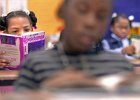 MHWrightreader1.JPG  Kiara Sutton, 10, left, and other fourth graders in Shannon Black&#39;s class at Mary H.Wright Elementary School, reads a book during class at the school in Spartanburg Tuesday afternoon. The school was awarded  grants for literacy, parent education, and staff development programs.